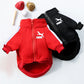 Red and black Puma pet jackets with sports equipment on a white background