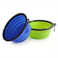 Blue and green collapsible pet bowls with carabiners on a white background