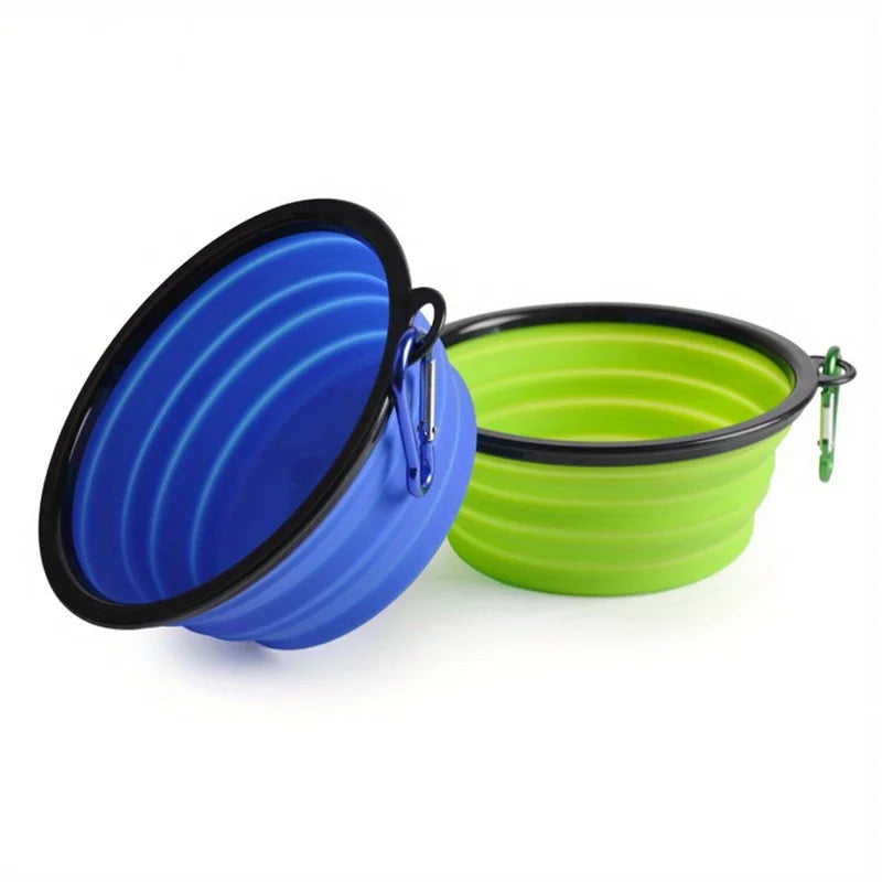 Blue and green collapsible pet bowls with carabiners on a white background