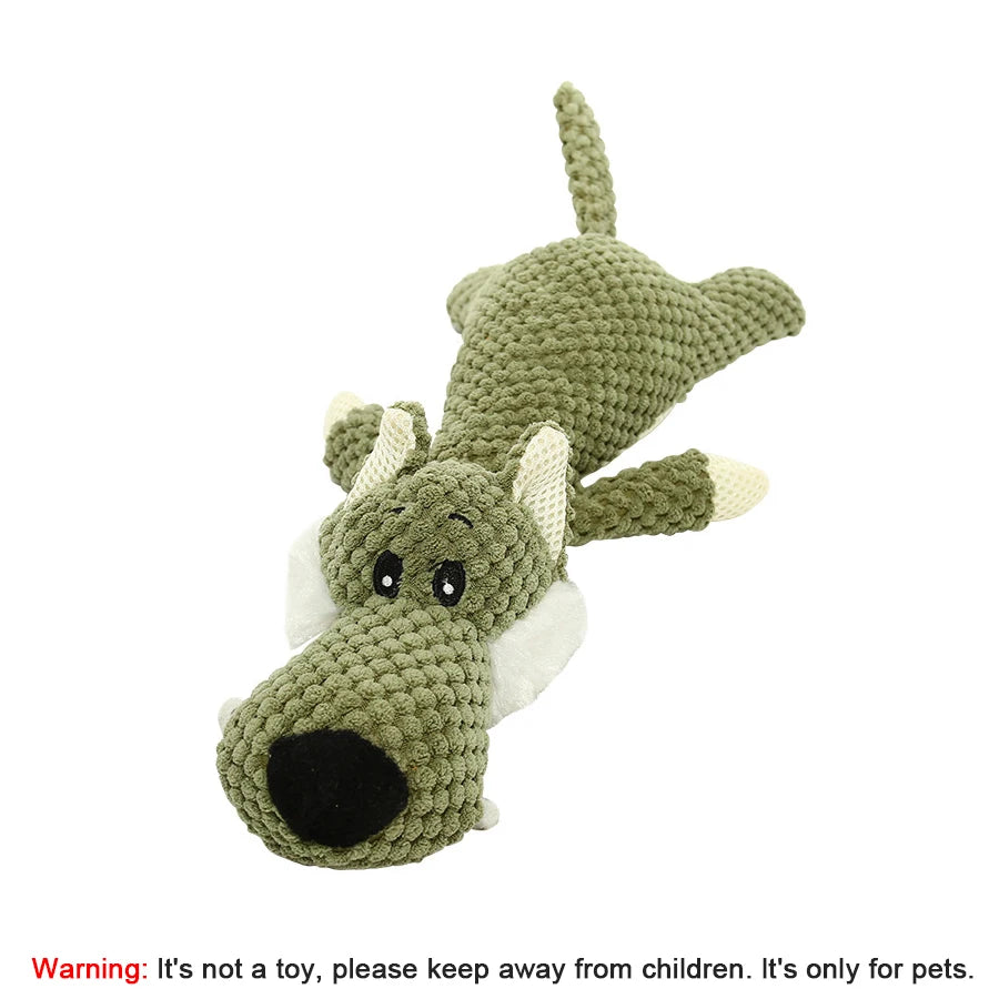 Crocheted dragon toy on a white background with a warning label.