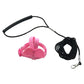 Pink dog leash with handle and coiled black leash on a white background