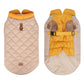 Quilted dog coat with yellow interior and beige exterior on a white background