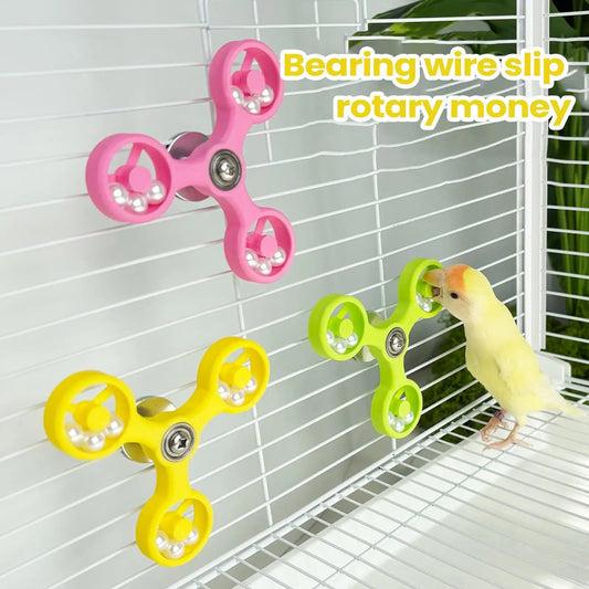 Bird toys with bearings on a birdcage, including pink, yellow, and green models.