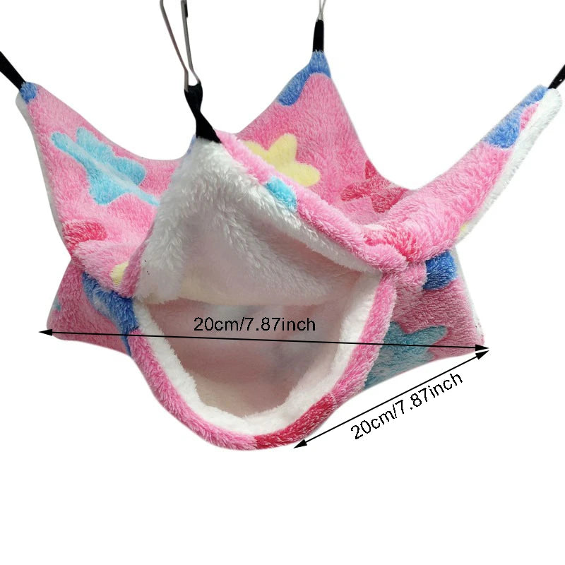 Pink pet hammock with colorful patterns and measurements on a white background