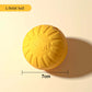 Yellow solid ball with measurement label on a beige background