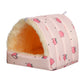 Pink pet bed with heart pattern on a white background