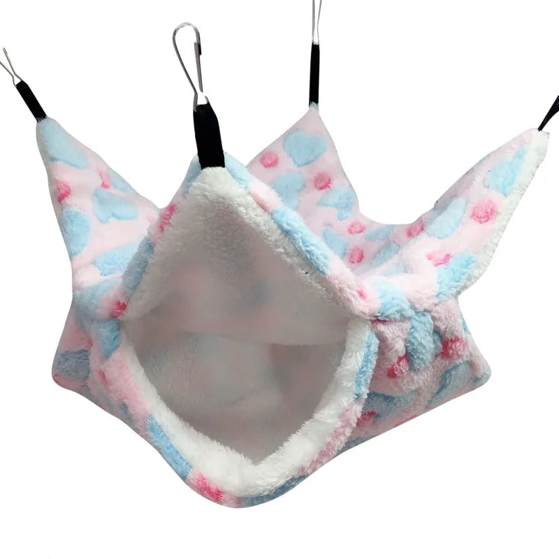 Plush pet hammock with floral pattern on a white background