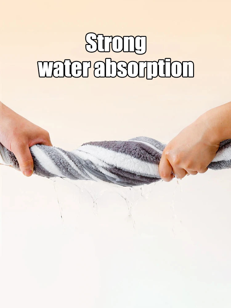 Text 'Strong water absorption' with hands holding a striped towel over water.
