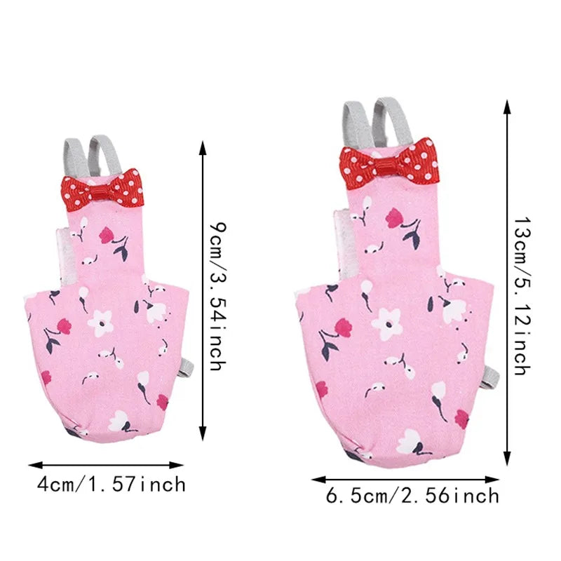 Pink baby romper with floral and bow design, shown with measurements on a white background.