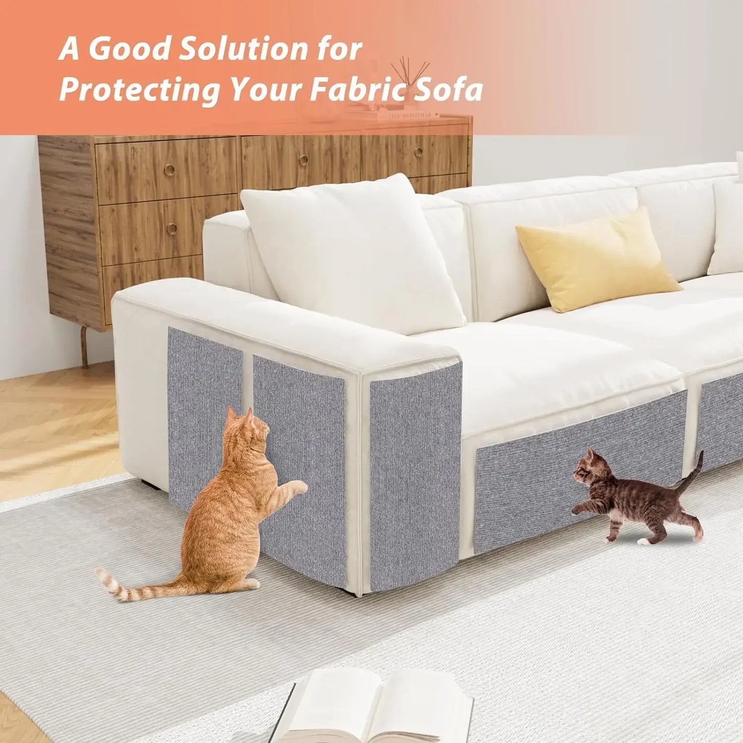 Sofa with a protective cover on a wooden floor, cats interacting with the cover.