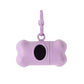 Purple dog bone-shaped treat dispenser with a keychain on a white background