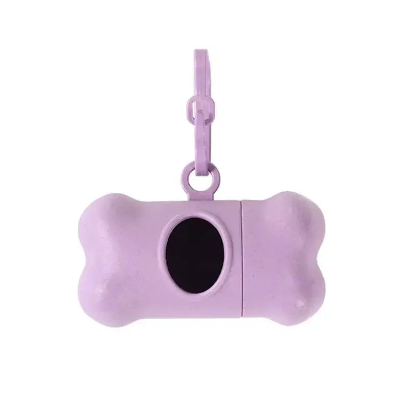 Purple dog bone-shaped treat dispenser with a keychain on a white background