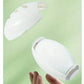 White container with a lid held by a hand against a light green background