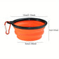 Orange collapsible travel bowl with black rim and red carabiner on a white background