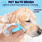 Dog being bathed with a pet bath brush against a blue background