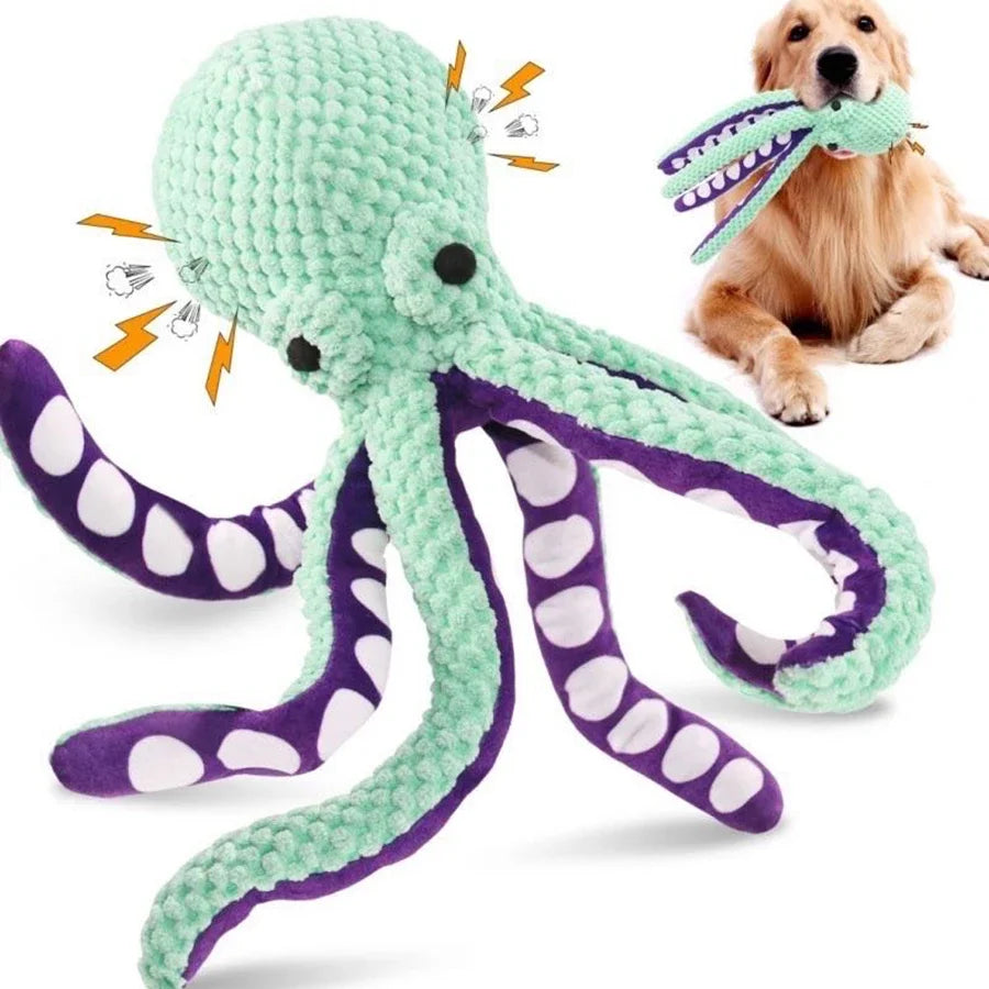 Green and purple octopus-shaped dog toy with a dog playing with it.
