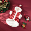Red and white dog coat with white fur trim, Christmas stockings, and wreath on a red background