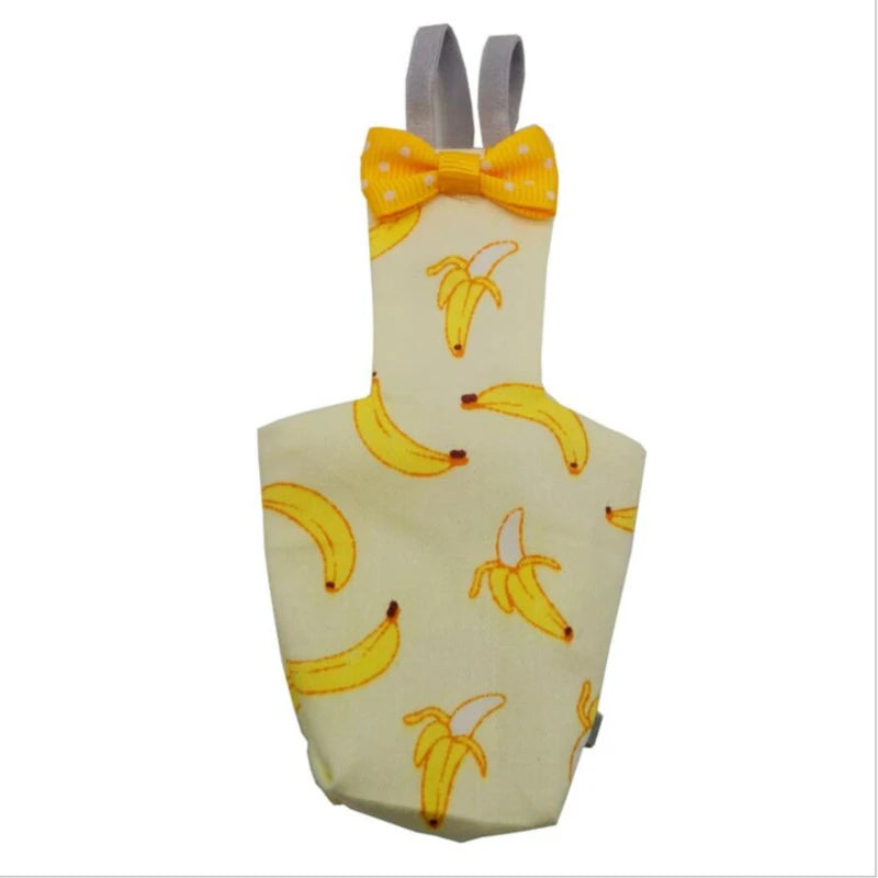 Pinafore with banana pattern and yellow bow tie on a white background