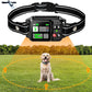 Dog collar with electronic device on a grassy field with trees in the background