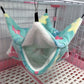 Colorful pet hammock hanging inside a cage with pink and white base.
