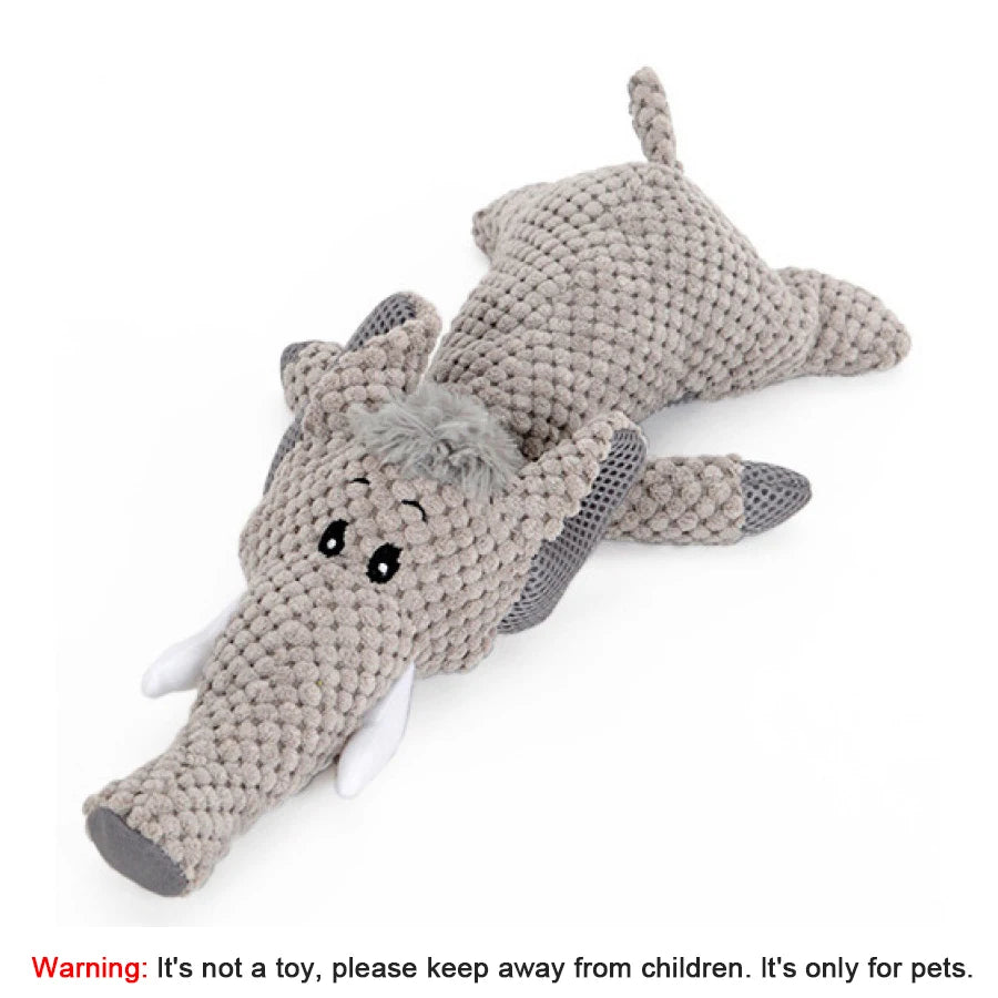 Knitted elephant toy on a white background with a warning label.