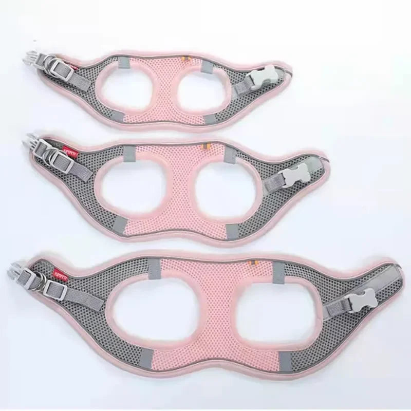 Three pink and gray dog harnesses on a white background