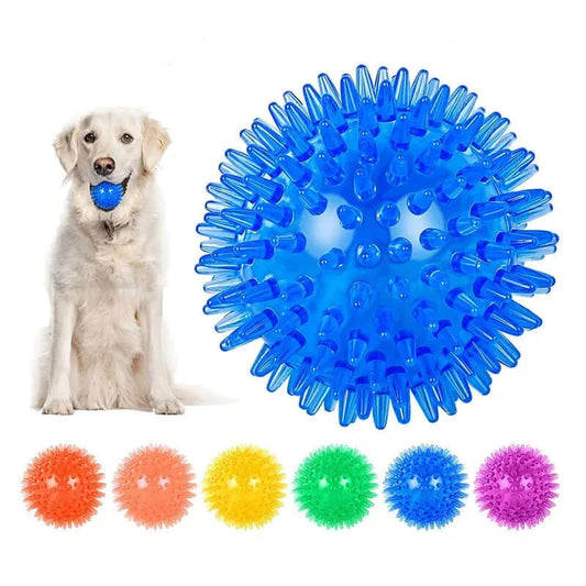 Dog playing with a blue spiky ball and additional color options displayed below.