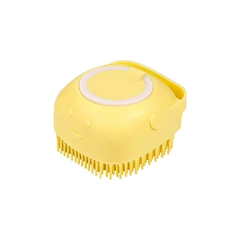 Yellow grooming brush with a smiley face design on a white background
