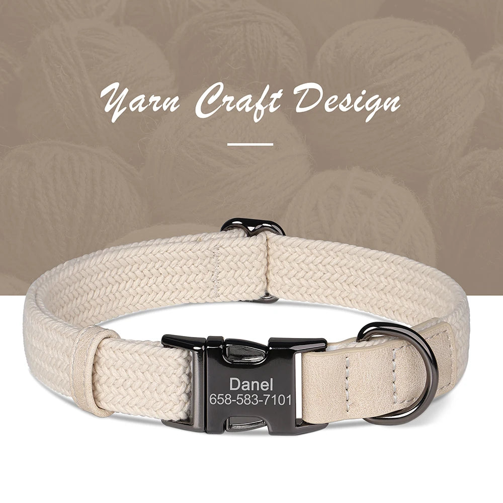 Beige dog collar with a black buckle and engraved nameplate on a neutral background.