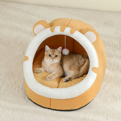 Cat lying inside a yellow pet bed with white interior on a beige surface