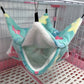 Colorful pet hammock hanging inside a cage with pink and white base.