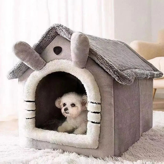 Dog peeking out from a gray pet house with a fluffy interior