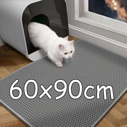 White cat entering a gray litter mat with dimensions 60x90cm.