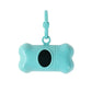 Turquoise bone-shaped pet toy with a black center on a white background