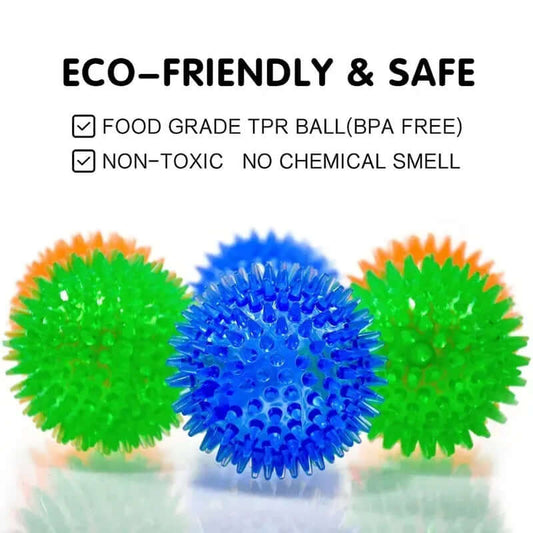 Three spiky balls in green, blue, and orange on a white background with text about eco-friendliness and safety.
