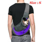 Person wearing a gray and purple pet carrier with a small dog inside, on a white background.