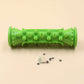 Green textured roller on a beige background with small items beside it.