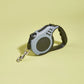 Retractable dog leash on a light yellow background