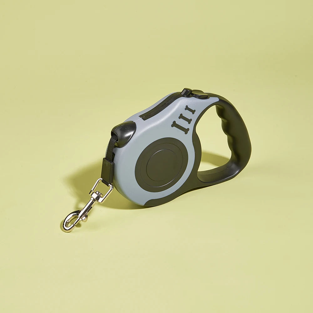 Retractable dog leash on a light yellow background