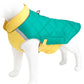Dog wearing a yellow and green quilted jacket on a mannequin.
