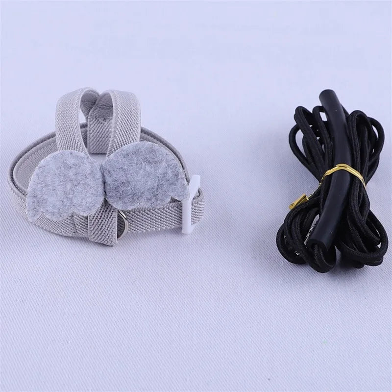 Gray headband with ear covers and black lanyard on a white background