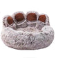 Plush toy shaped like a bear paw with brown pads on a white background