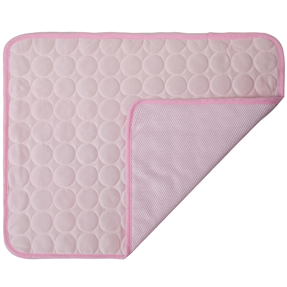 Pink quilted mat with a textured pattern on a white background