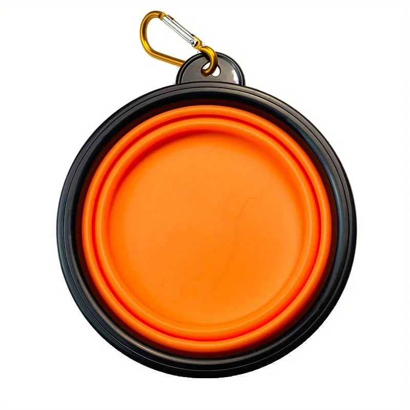 Orange pet bowl with black rim and gold carabiner on a white background