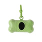 Green bone-shaped pet toy with a black center on a white background