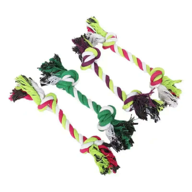 Colorful dog rope toys with tassels on a white background