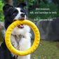 Dog holding a yellow rubber ring with text about its properties