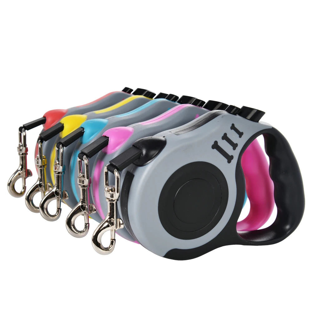 Set of colorful retractable dog leashes on a white background
