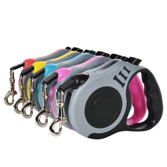 Set of colorful retractable dog leashes on a white background