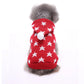 Red dog sweater with white star patterns and a white pom-pom on a white background